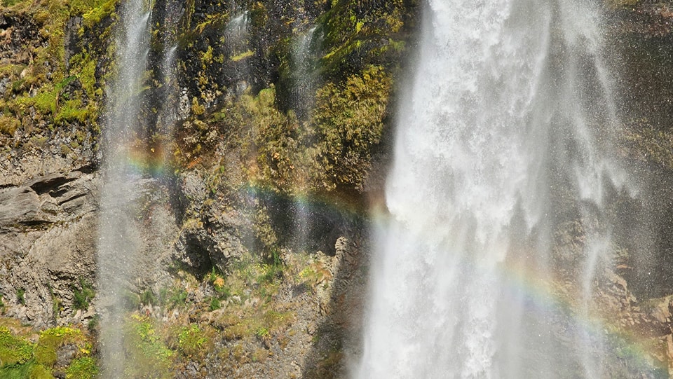 A rainbow created by the Seljalandsfoss waterfall.#iceland #seljalandsfosswaterfall #waterfall #walk #getoutside #photography #outdoorescape #hiking #outdooradventures #hikingadventures #outdoorphotography #nature #explore #outdooradventurer #exploremore #instagood #walking #amaturephotography